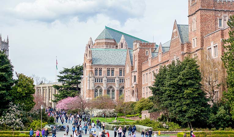 Outside of Mary Gates Hall on University of Washington campus with students walking by