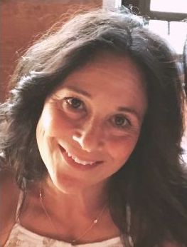 Jessica smiles at the camera.