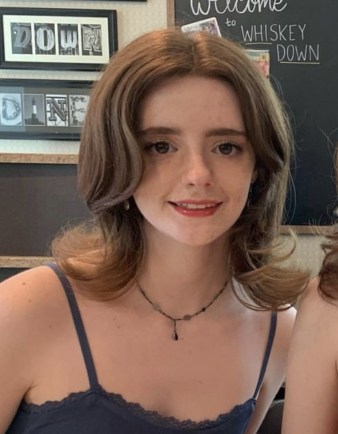 Julia looks at the camera.