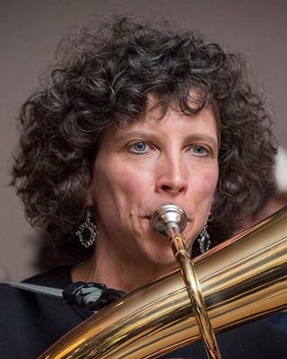 Whitney plays a brass instrument.